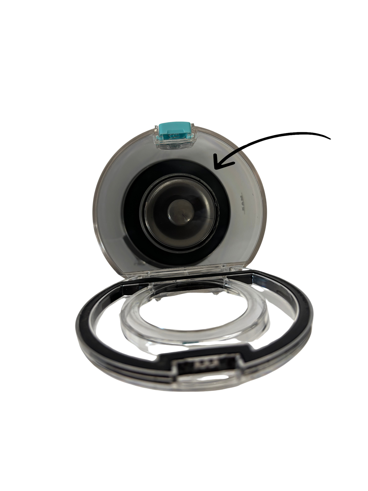 Close-up view of a transparent circular component with a black inner ring and a small blue latch on top, likely part of a cleaning device accessory.