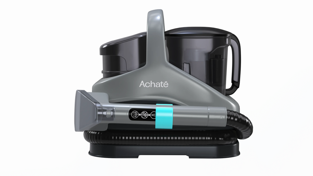 Compact grey handheld steam cleaner with ergonomic handle, detachable water tank, and long flexible hose for versatile multi-surface chemical-free cleaning.