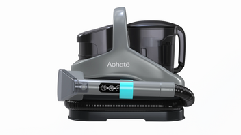 Compact grey handheld steam cleaner with ergonomic handle, detachable water tank, and long flexible hose for versatile multi-surface chemical-free cleaning.