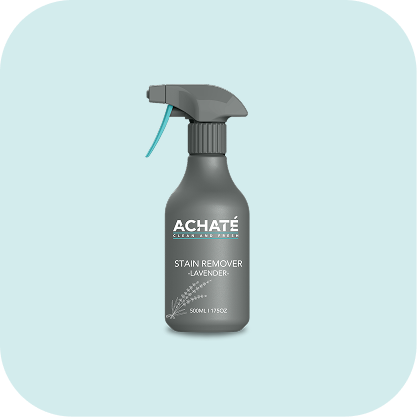 Gray spray bottle labeled Achaté stain remover with lavender scent on a pale blue background