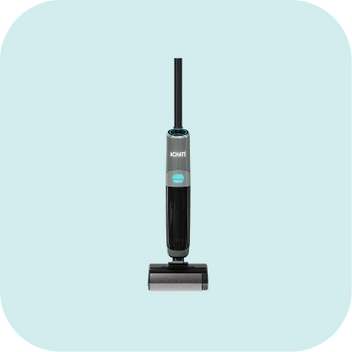 Upright cordless stick vacuum cleaner in black and gray with a turquoise accent on a light blue background, designed for multi-surface chemical-free cleaning.