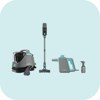 Set of modern cleaning tools including a high steam pressure cleaner with brush, a cordless stick vacuum, a handheld steam cleaner, and a spray bottle on a light background.