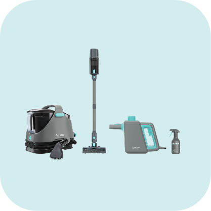 Set of modern cleaning tools including a high steam pressure cleaner with brush, a cordless stick vacuum, a handheld steam cleaner, and a spray bottle on a light background.