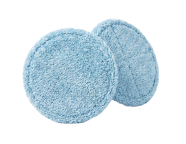 Two round blue microfiber cleaning pads with textured surfaces, shown on a black background.