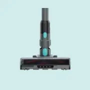Close-up view of the bottom cleaning head of a cordless stick vacuum cleaner with a sleek black design against a light blue background.