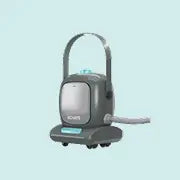 Compact steam cleaner with a modern design featuring a handle, hose attachment, and control panel, suitable for deep chemical-free cleaning tasks.