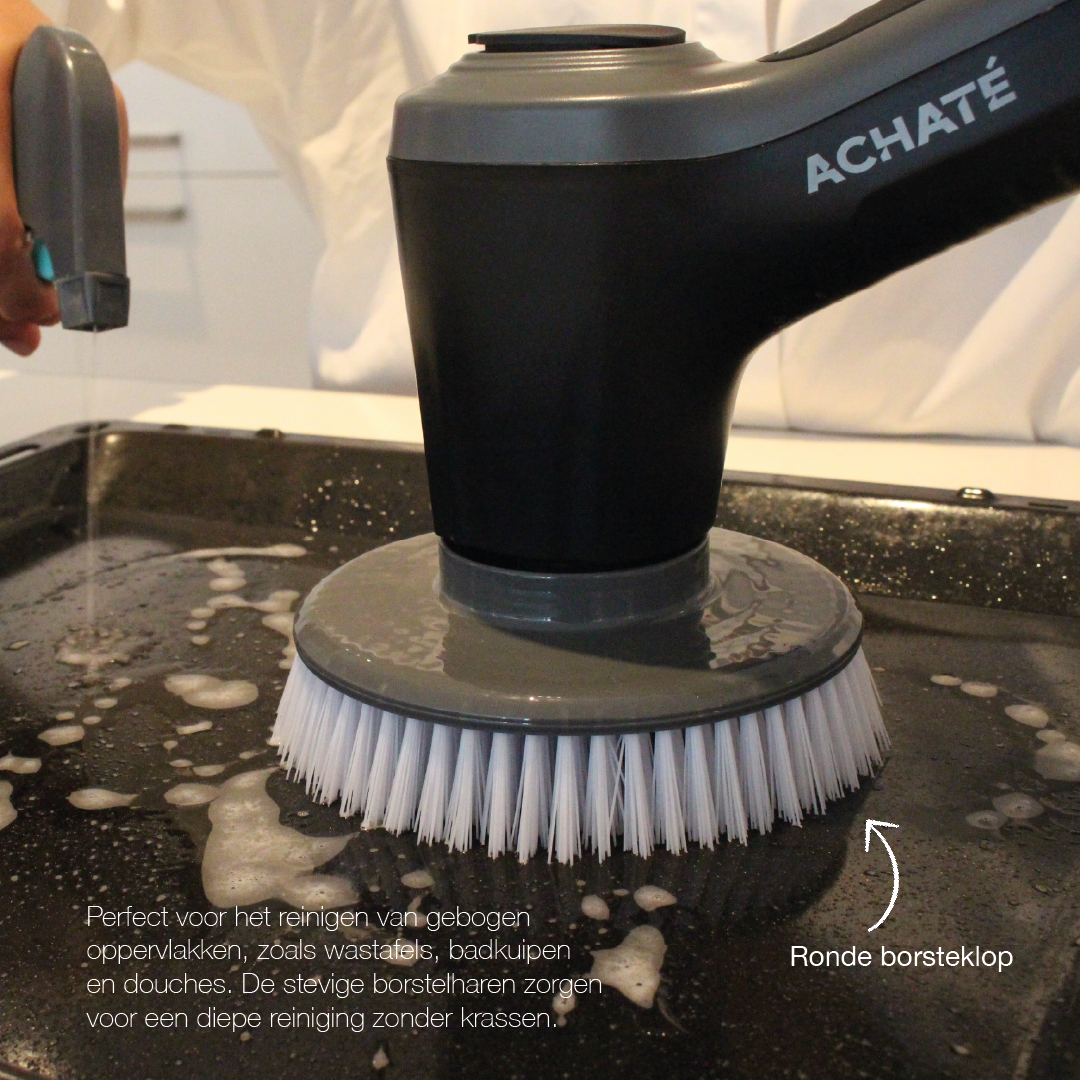 Close-up of a black and gray electric cleaning brush with white bristles scrubbing a wet surface, demonstrating deep cleaning on curved areas.